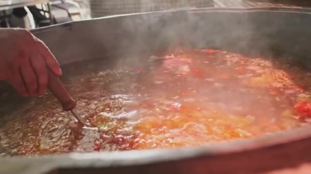 Chef Mixes Meat Soup Vegetables Large Cauldron Slotted Spoon Slow — Stock Video