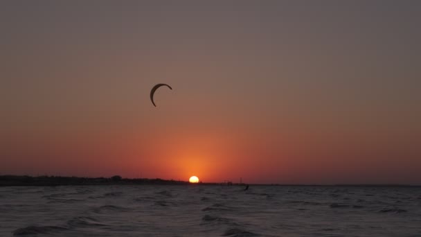 Kiteboarding Sunset Man Kiteboard Rides Evening Mans Silhoulette Setting Sun — Stock video