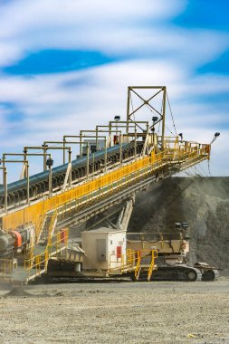 Portable conveyor belt machinery at a copper mine in Chile clipart