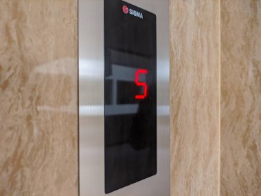 malang, indonesia -27 november, 2022 : digital or modern model elevator floor pointer shows the number 5 which means the elevator is on the fifth floor