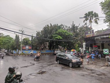 Malang, Indonesia -January 20, 2023 : power lines crossing the highway after heavy rain and extreme weather. electrical wiring hazards due to extreme weather
