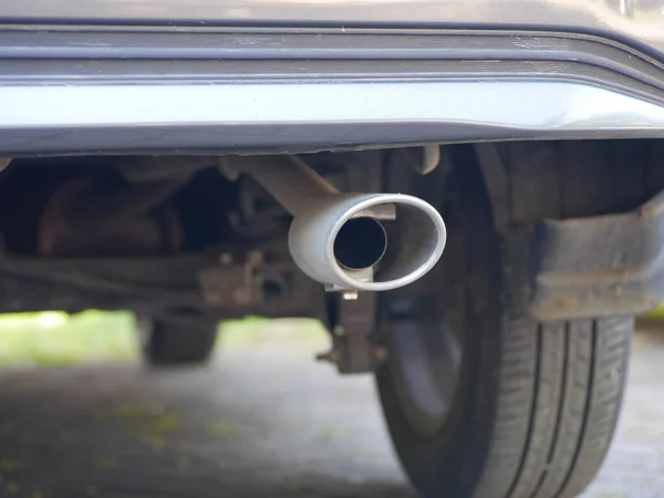 car exhaust with oval round shape. the concept of environmental pollution due to motor vehicle exhaust emissions