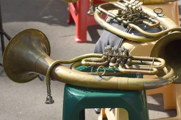 Brass wind instruments during a musical performance. A jazz band plays in the park.