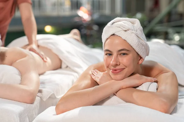 Beautiful young woman relaxed in spa salon,Traditional aroma therapy and beauty treatments, Outdoor spa in gardens and natural light.