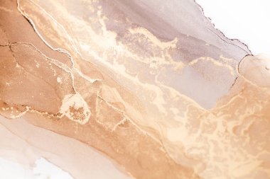 Sıvı, soyut, kıvrımlı, ruhani, altın ve bej renkli bir tablonun karmaşık detaylarını gösteren yakın plan bir resim..