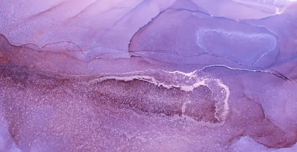 stock image A close-up of an abstract painting featuring swirling patterns of purple and silver ink, creating a fluid and ethereal effect.