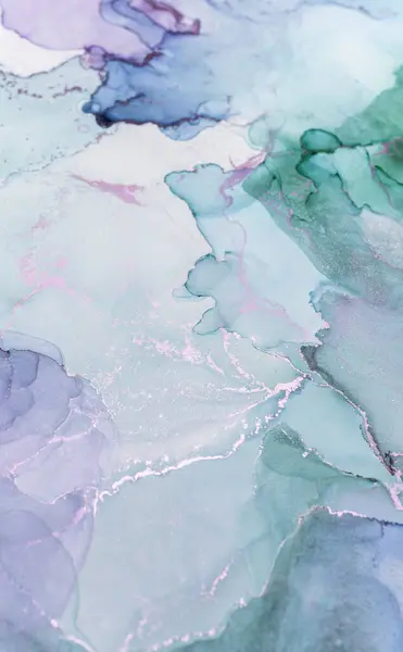 stock image Delicate shades of green and blue blend together in an abstract watercolor composition, highlighting the fluidity of the pigments and textures.