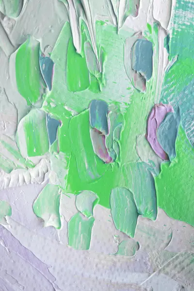 Stock image Thick layers of paint create a dynamic texture with various hues of green and pastel shades, capturing the essence of abstract art in bright daylight.