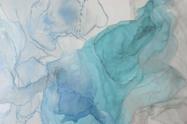 This artwork features captivating alcohol ink designs with flowing patterns in shades of blue and teal, creating a serene and dynamic visual experience that draws the viewers attention. clipart