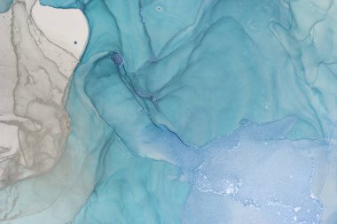 Swirls of vibrant blue and gray alcohol ink create an abstract composition that conveys fluidity and movement. The delicate interplay of colors invites contemplation of natural beauty. clipart