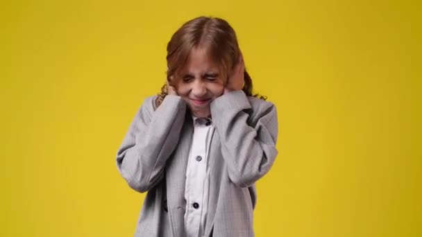 Slow Motion Video Girl Closing Her Ears Hands Yellow Background — Stock Video