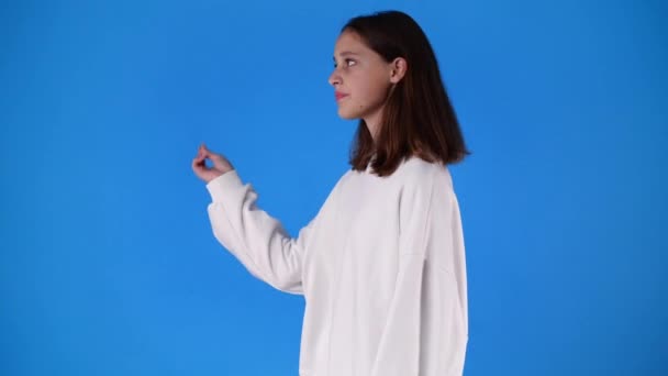 Slow Motion One Girl Gesturing Finger Blue Background Concept Emotions — Stock Video