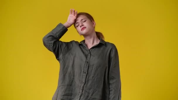 Video Cute Girl Touching Her Head Yellow Background Concept Emotions — Stock Video