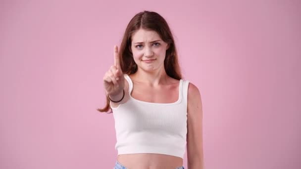 Slow Motion One Girl Gesturing Finger Pink Background Concept Emotions — Vídeos de Stock