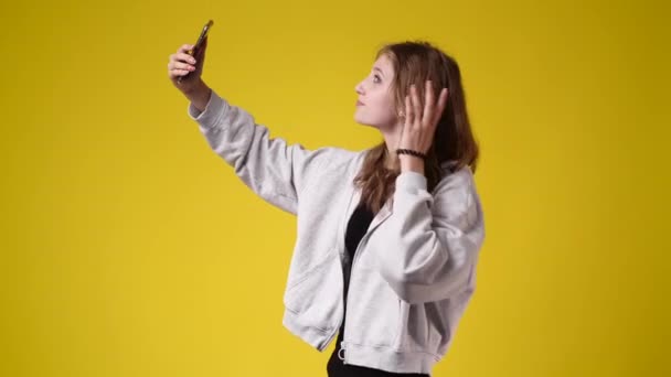 Slow Motion Video Beautiful Girl Making Selfie Yellow Background Concept — Stock Video