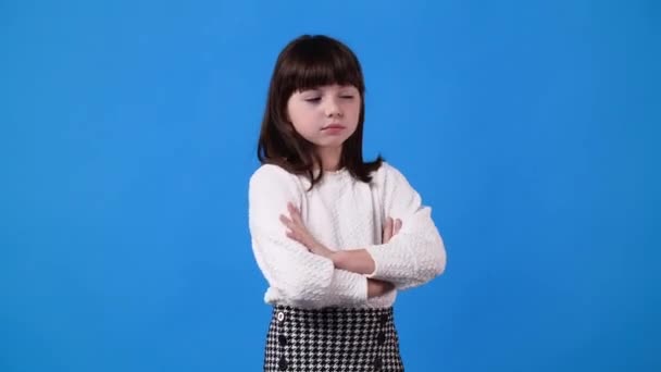 Slow Motion Video One Girl Negative Facial Expression Blue Background — Stockvideo