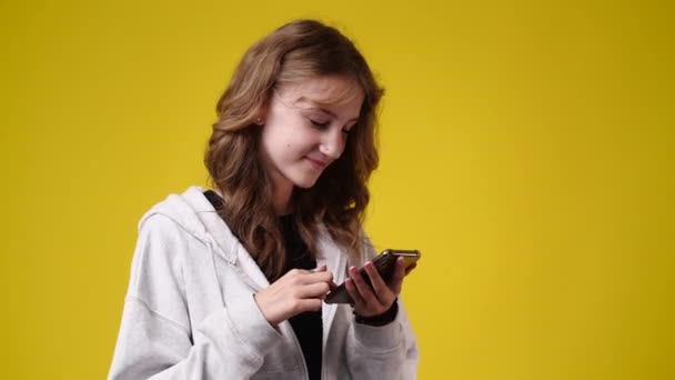 Slow Motion Video One Girl Sending Messages Yellow Background Concept — Video