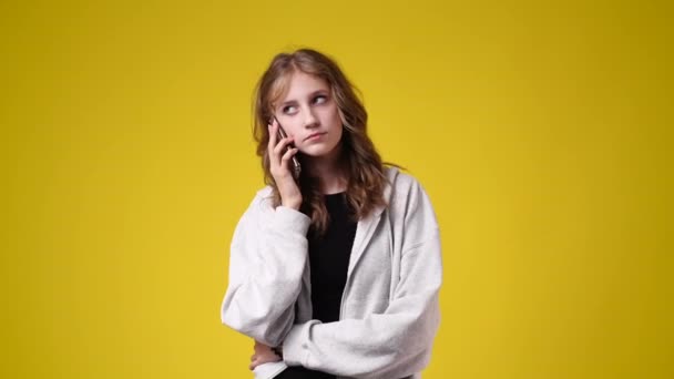 Slow Motion Video One Girl Talking Phone Yellow Background Concept — Vídeo de stock