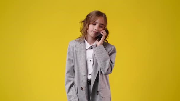 Slow Motion Video One Girl Talking Phone Yellow Background Concept — Stock Video