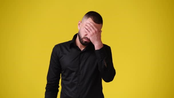 Slow Motion Video One Man Having Headache Yellow Background Concept — Stock Video