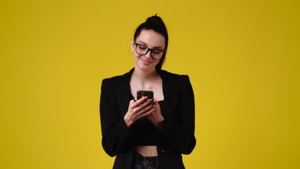 Slow Motion Video One Girl Using Phone Yellow Backgrpound Concept — Video