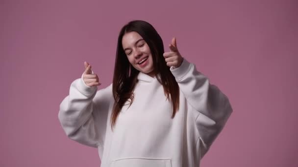 Slow Motion Video One Girl Pointing Camera Showing Thumbs Pink — Stockvideo