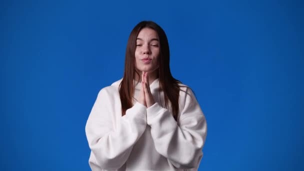 Video Girl Begging Something Blue Background Concept Emotions — Stockvideo
