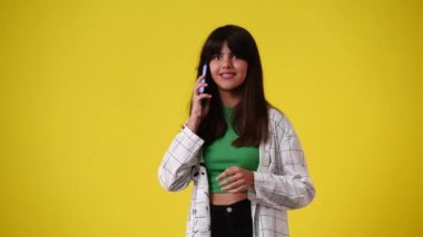 4k slow motion video of excited girl having a talk over the phone. Concept of emotions.