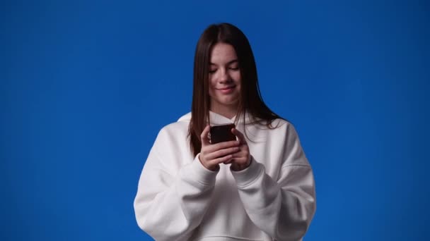 Video One Girl Typing Text Looking Blue Background Concept Emotions — Vídeo de Stock