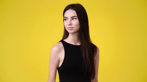 Video One Girl Looks Showing Silence Sign Yellow Background Concept — Vídeo de Stock