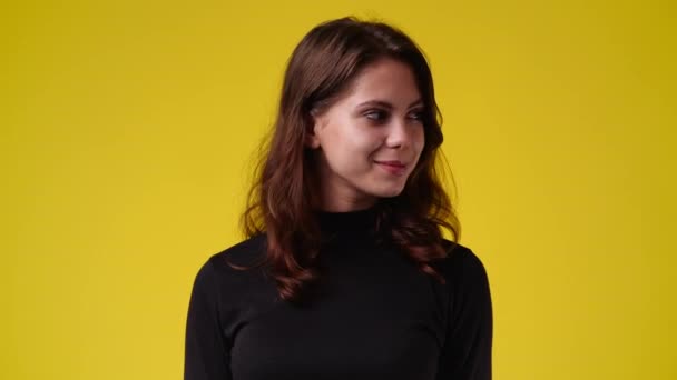 Video One Girl Looks Showing Silence Sign Yellow Background Concept — Stock video