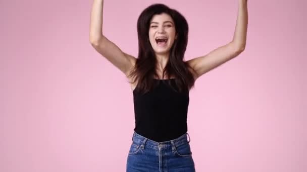 Video One Girl Who Jumps Happily Pink Background Concept Emotions — Vídeos de Stock