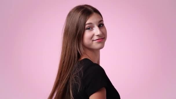 Video One Girl Turns Fixes His Hair Pink Background Concept — Vídeo de Stock