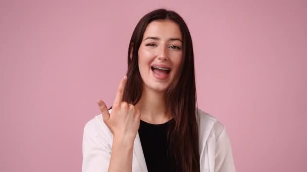 Video One Girl Pointing Her Braces Showing Thumb Concept Emotions — Stockvideo