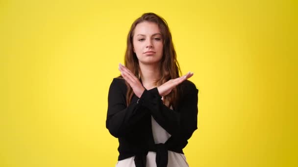 Video One Girl Showing Stop Sign Yellow Background Concept Emotions — Vídeo de Stock