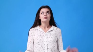 4k video of girl begging please on pink background. Concept of emotions.