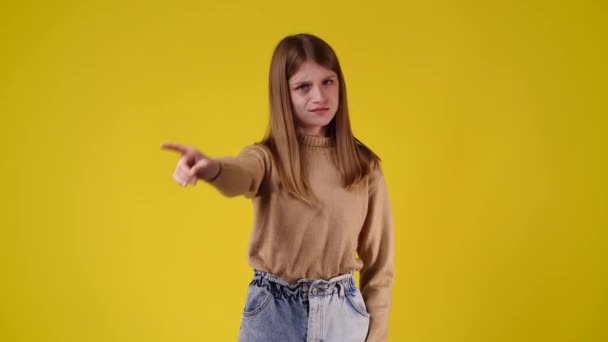 Slow Motion Video One Girl Stops Prohibits Yellow Background Concept — Wideo stockowe
