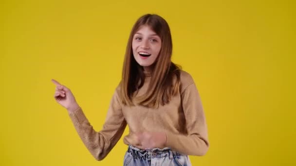 Video One Girl Showing Left Thumbs Yellow Background Concept Emotions — Vídeos de Stock