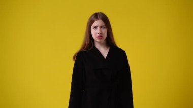 4k video of one girl with negative facial expression. Concept of emotions.