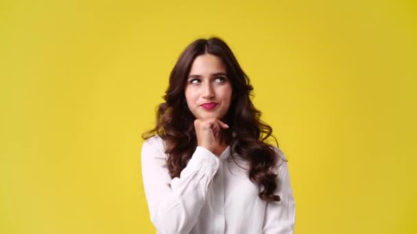 Video One Girl Thinking Something Showing Pointing Yellow Background Concept — Stock video