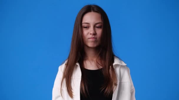 Video One Girl Closes Nose Smell Blue Background Concept Emotions — Vídeo de stock