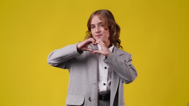 Video One Girl Who Showing Sign Heart His Hands Yellow — Vídeo de Stock