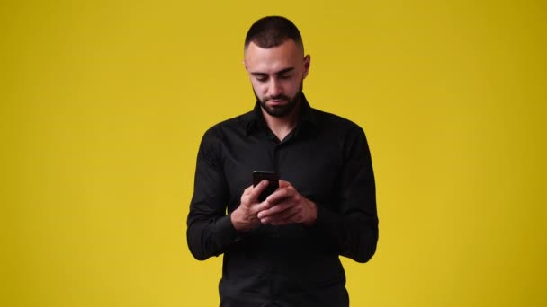 Video One Man Using Phone Yellow Background Concept Emotion — Vídeo de stock
