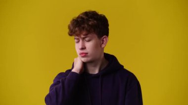 4k video of one man posing for a video over yellow background. Concept of emotions.
