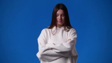 4k video of cute woman over blue background. Concept of emotions.