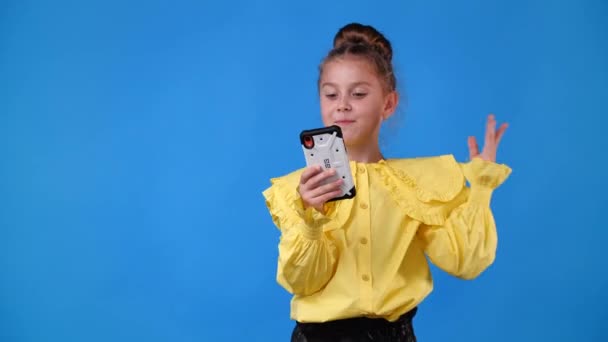 Video One Girl Sending Messages Blue Background Concept Emotions — Vídeos de Stock