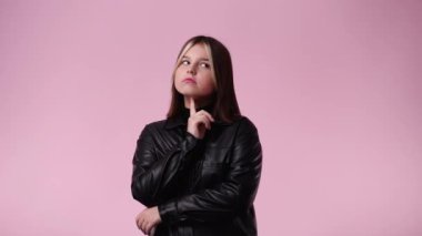 4k video of one girl posing for a video over pink background. Concept of emotions.