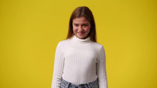 Video One Girl Pointing Camera Showing Thumbs Yellow Background Concept — Vídeo de Stock