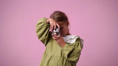 4k video of one girl posing for a video over pink background. Concept of emotions.