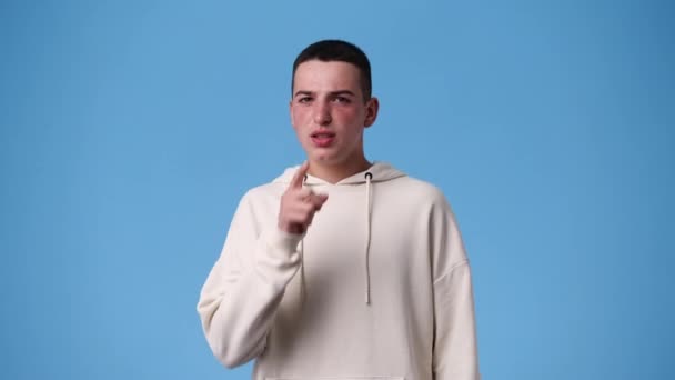 Slow Motion Video One Man Showing Silence Sign Blue Background — Stok video